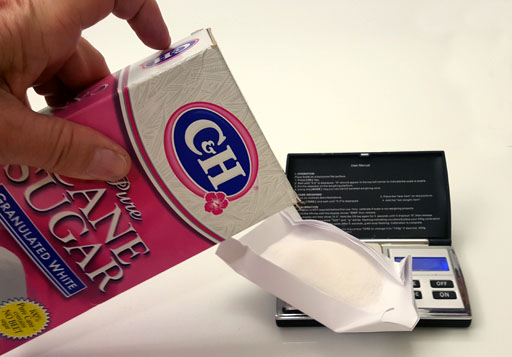 Pour sugar onto boat