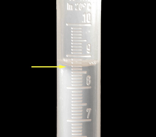 close up of water in 10 mL graduated cylinder