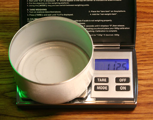 metal can being weighed