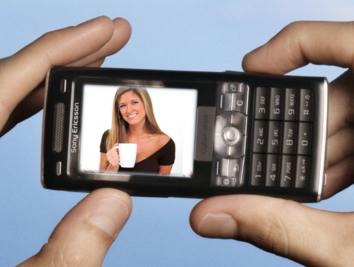 camera phone showing person with drink