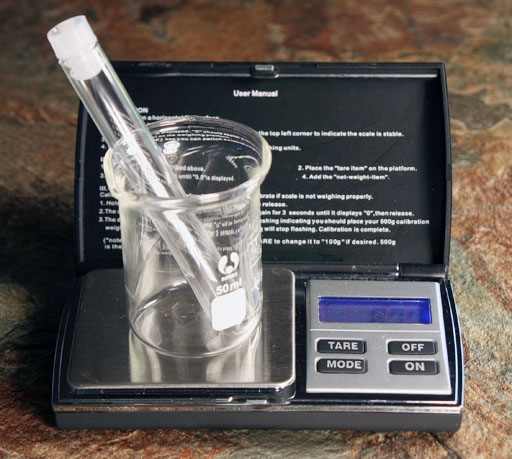 Test tube and beaker on balance