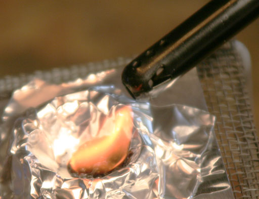 Ignite melted sugar with lighter