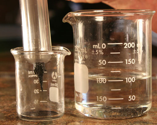 transfer black sand to 50 mL beaker
