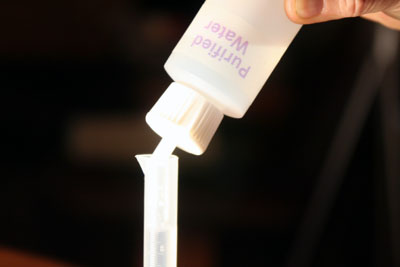 Fill up 10 mL grad cylinder with water
