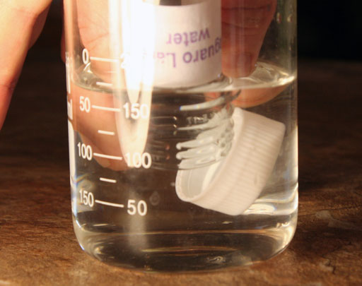 Cap is off large test tube underwater