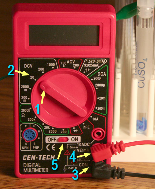 How do you test a battery with a multimeter?