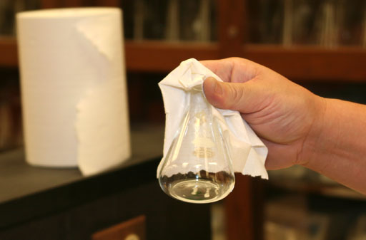 Grab flask with paper towel