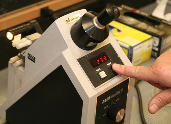 Push temperature button on Refractometer