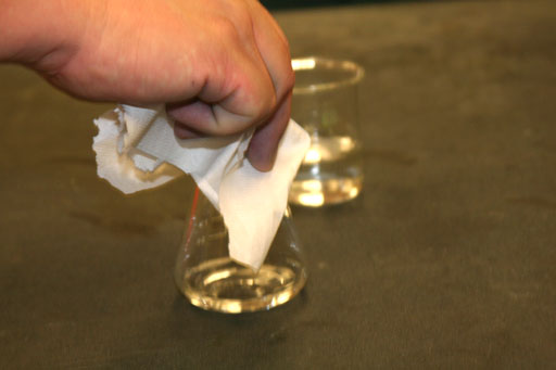 Fill flask grabbed with paper towel